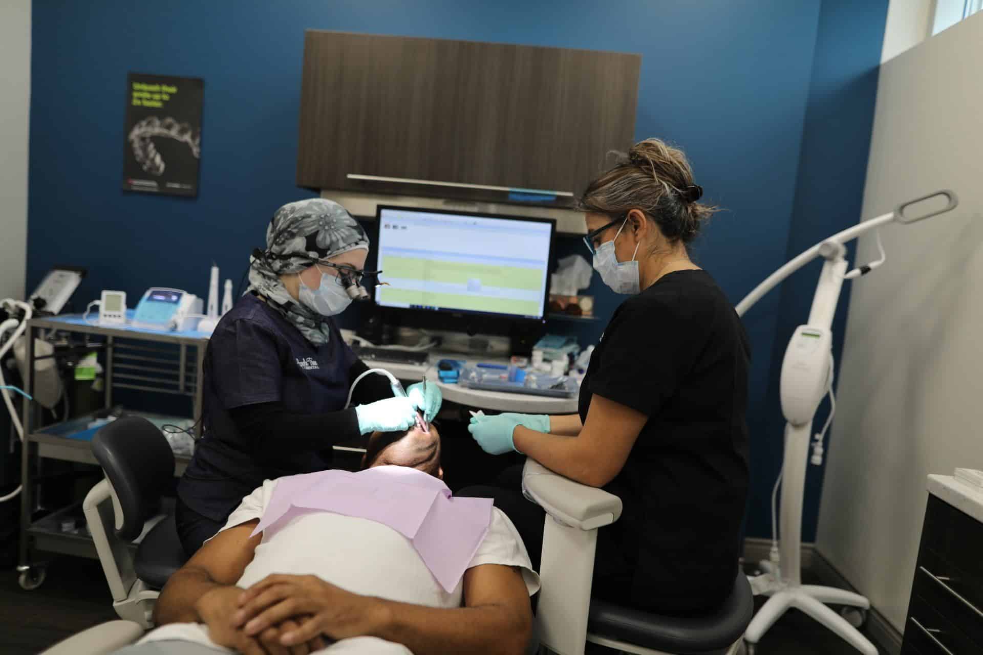 Experts treating dental issue of a patient