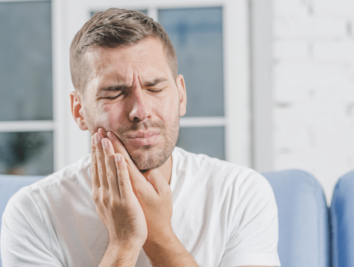 Close up of the man suffering from toothache